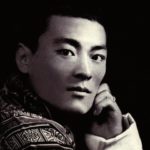 Black and white close up image of a strong featured bhutanese man.